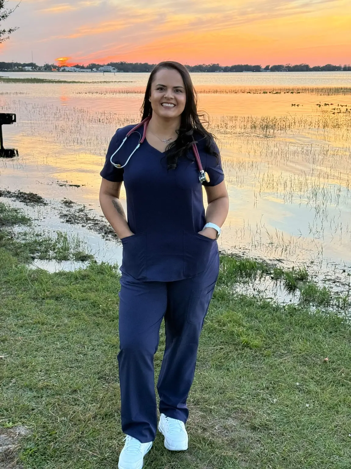Camila wearing nursing scrubs and a stethoscope in Central Florida